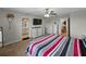Well-lit main bedroom with doorways leading to the bathroom and hallway at 11287 Cay Spruce Way, San Antonio, FL 33576