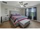 Comfortable main bedroom with a ceiling fan, neutral walls, and coordinating furniture at 11287 Cay Spruce Way, San Antonio, FL 33576