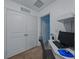 A small office with white walls, carpet, and a built-in desk and shelving at 11287 Cay Spruce Way, San Antonio, FL 33576