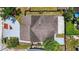 Aerial view showing the house roof, and a screened patio set within the fenced perimeter at 11320 Partridge Dr, Tampa, FL 33625
