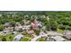 An aerial view of a neighborhood showcasing the surrounding landscape and the subject property's location at 11320 Partridge Dr, Tampa, FL 33625