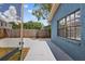 The home backyard includes a concrete patio and a view of the home's screened back porch at 11320 Partridge Dr, Tampa, FL 33625