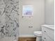 Bathroom with marble-patterned tiles and a modern vanity at 11320 Partridge Dr, Tampa, FL 33625