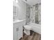 Modern bathroom with sleek vanity, toilet, and tiled shower-tub combination at 11320 Partridge Dr, Tampa, FL 33625