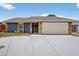 Beautiful single-story home boasting a two-car garage, stone accents, and a well-manicured front lawn at 11320 Partridge Dr, Tampa, FL 33625