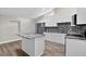 A modern kitchen with stainless steel appliances and a kitchen island at 11320 Partridge Dr, Tampa, FL 33625