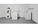 Well-organized laundry room with appliances and storage shelves at 11320 Partridge Dr, Tampa, FL 33625