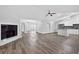 Open floor plan with living room fireplace and modern eat-in kitchen at 11320 Partridge Dr, Tampa, FL 33625