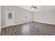 This living room is bright and airy with wood floors and a door to the outside at 11320 Partridge Dr, Tampa, FL 33625