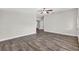 Large living room with wood floors and a ceiling fan at 11320 Partridge Dr, Tampa, FL 33625