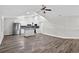 Living area with fireplace, kitchen island, modern flooring, and stainless appliances at 11320 Partridge Dr, Tampa, FL 33625