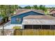 Backyard featuring a screened patio, fenced yard, mature trees offering shade and privacy from neighbors at 11320 Partridge Dr, Tampa, FL 33625