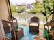 Cozy balcony with comfortable seating and a peaceful view of the waterway at 115 Brent Cir, Oldsmar, FL 34677