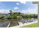 Waterfront view from balcony showcasing the private dock and surrounding scenery at 115 Brent Cir, Oldsmar, FL 34677