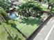 The backyard features a fenced in private pool, well manicured lawn, landscaping and outdoor living space at 11525 Country Oaks Dr, Tampa, FL 33618