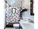 Nicely appointed bathroom with decorative tile and a modern shower at 11525 Country Oaks Dr, Tampa, FL 33618