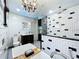 A renovated bathroom features a luxurious tub, sleek glass shower, and modern black accents and finishes at 11525 Country Oaks Dr, Tampa, FL 33618