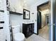 Updated bathroom with decorative tile, storage vanity, and modern fixtures at 11525 Country Oaks Dr, Tampa, FL 33618