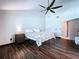 Primary bedroom featuring vaulted ceilings, wood-look floors and ensuite bathroom at 11525 Country Oaks Dr, Tampa, FL 33618