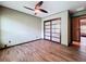 A nicely sized bedroom includes a closet with sleek, modern sliding doors and stylish wood-look laminate flooring at 11525 Country Oaks Dr, Tampa, FL 33618