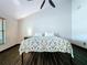 Bright bedroom with vaulted ceiling, ceiling fan, and wood-look floors at 11525 Country Oaks Dr, Tampa, FL 33618