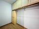 Practical walk-in closet features built-in shelving, providing ample storage space for clothing and accessories at 11525 Country Oaks Dr, Tampa, FL 33618