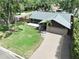 Beautiful single-Gathering home features a well manicured lawn, new roof, and attached two car garage at 11525 Country Oaks Dr, Tampa, FL 33618