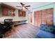 Well-lit home office with custom desk, storage and a ceiling fan at 11525 Country Oaks Dr, Tampa, FL 33618