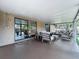 Covered patio with stylish outdoor furniture, providing a comfortable space for relaxation and gatherings at 11525 Country Oaks Dr, Tampa, FL 33618