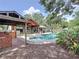 Backyard oasis featuring a pool, patio, outdoor seating, and a built-in barbeque, great for entertaining at 11525 Country Oaks Dr, Tampa, FL 33618