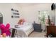 Comfortable bedroom featuring a cozy bed, natural light, and stylish decor at 11849 Forest Park Cir, Bradenton, FL 34211
