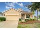 Charming single-story home with a manicured lawn, attached garage, and inviting front porch at 11849 Forest Park Cir, Bradenton, FL 34211