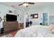 Open main bedroom with hard floors, a walk-in closet, and a view of the ensuite bathroom at 11849 Forest Park Cir, Bradenton, FL 34211