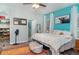 Bright and spacious main bedroom with a ceiling fan, a walk in closet, and a blue accent wall at 11849 Forest Park Cir, Bradenton, FL 34211