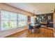 Bright dining area features hardwood floors, a modern chandelier, and ample natural light at 1220 Magnolia Dr, Clearwater, FL 33756