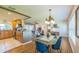 Open-concept dining area with seamless access to the kitchen, breakfast bar, and cozy living area at 1220 Magnolia Dr, Clearwater, FL 33756