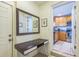 Hallway with a desk, mirror, and access to kitchen at 1220 Magnolia Dr, Clearwater, FL 33756
