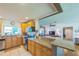Kitchen featuring stainless steel appliances, granite countertops, and open breakfast bar at 1220 Magnolia Dr, Clearwater, FL 33756