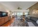 Inviting living room featuring hardwood floors, stylish decor, and seamless transition to the dining area at 1220 Magnolia Dr, Clearwater, FL 33756