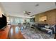 Open living space with hardwood floors, stylish furnishings, and views into the dining room at 1220 Magnolia Dr, Clearwater, FL 33756
