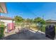 This patio boasts an outdoor dining set, hammock, and oversized games for entertainment at 1220 Magnolia Dr, Clearwater, FL 33756