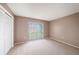 Neutral bedroom with window overlooking the yard at 13013 Sawmill Way, Hudson, FL 34667