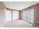 Neutral bedroom with large closet and window at 13013 Sawmill Way, Hudson, FL 34667
