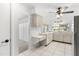Bright kitchen with white cabinets, desk and view to the exterior at 13013 Sawmill Way, Hudson, FL 34667