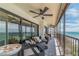 Covered balcony with comfortable seating and views of the beach at 15000 Gulf Blvd # 901, Madeira Beach, FL 33708