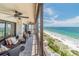 Relax on the covered and furnished balcony with beautiful beach views at 15000 Gulf Blvd # 901, Madeira Beach, FL 33708