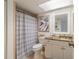Bathroom featuring a shower with a stylish curtain, toilet, and a vanity at 15000 Gulf Blvd # 901, Madeira Beach, FL 33708