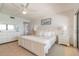 Bright bedroom with white furniture and calming beach artwork at 15000 Gulf Blvd # 901, Madeira Beach, FL 33708