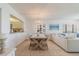 Dining room with seating for four with an open view of the living room at 15000 Gulf Blvd # 901, Madeira Beach, FL 33708