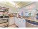 Well-lit kitchen featuring stainless steel appliances and granite countertops at 15000 Gulf Blvd # 901, Madeira Beach, FL 33708